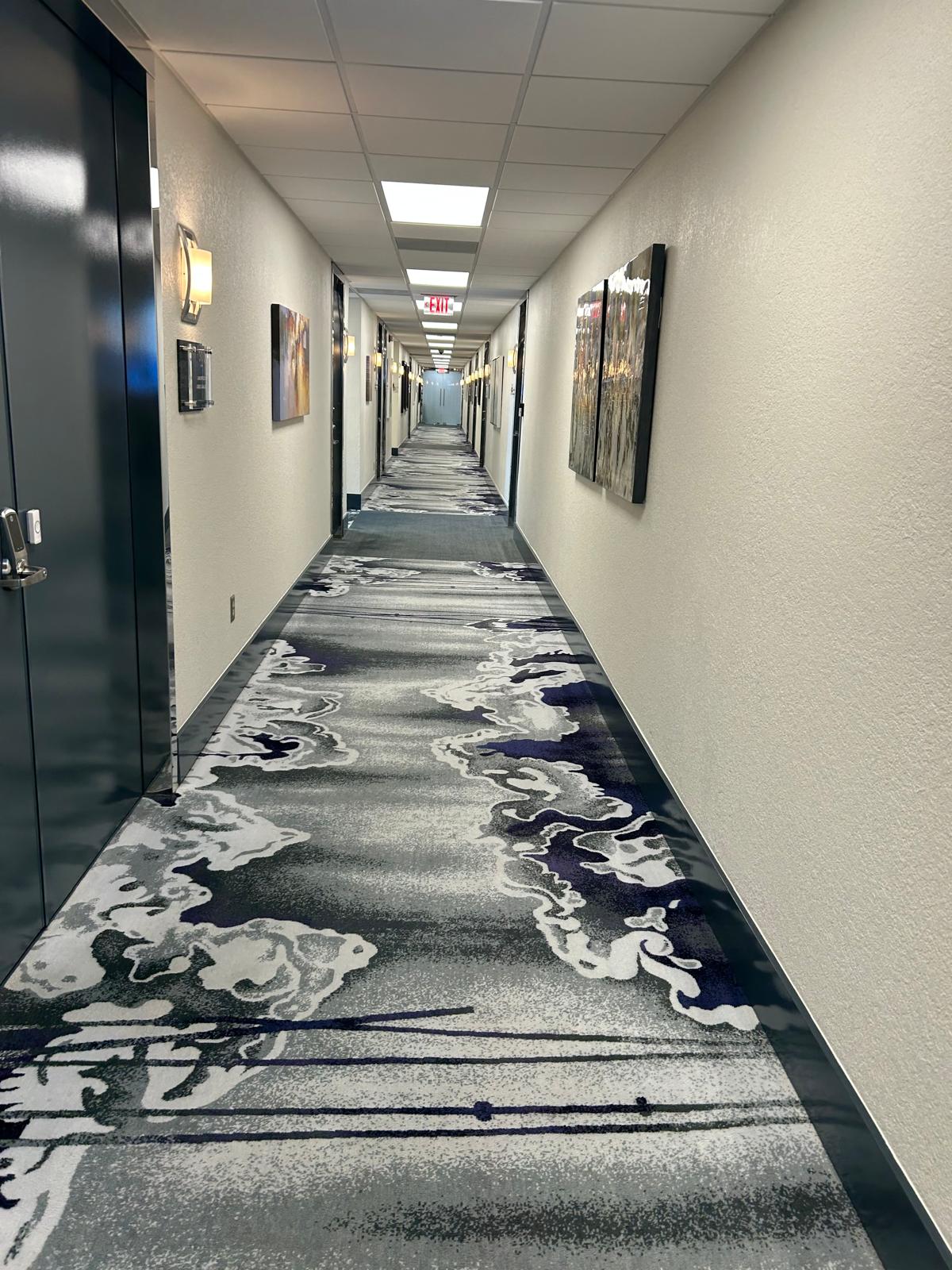 Carpet hallway installation by Imperio Flooring